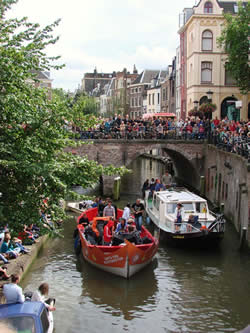 A boat concert parade in one of the canals running through the city