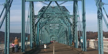 Crossing the Tennessee River on the Walnut Street Bridge is only possible by foot or by bike. Built in 1890, it is one of the world's longest pedestrian bridges. 