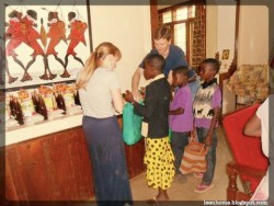 Us Handing Out Nutritional Supplements with a Local Kid's Group