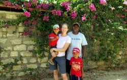 the Kenyan-Texan family in front of bougainvillea