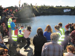 Competing in the World Stone Skimming Championships, Easdale, Scotland