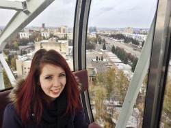 A photo of me on one of two Ferris wheels in the city.